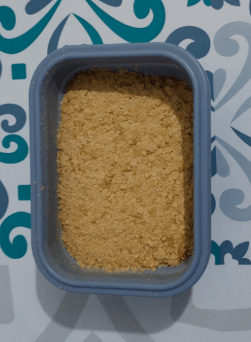 Nutritional yeast in a tupperware container.