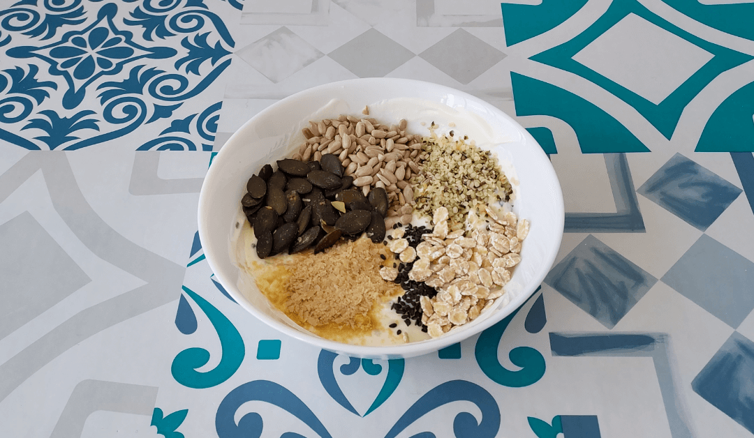 Muesli: Yoghurt topped with seeds, whole grain barley and nutritional yeast.