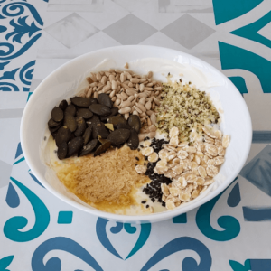 Muesli: Yoghurt topped with seeds, whole grain barley and nutritional yeast.