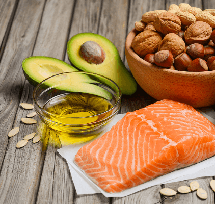 Foods that contain omega-3 fatty acids, like avocados, walnuts and salmon.