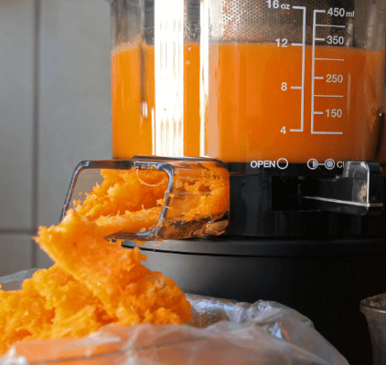 Fruit juicer removing the healthy fibre from oranges. 