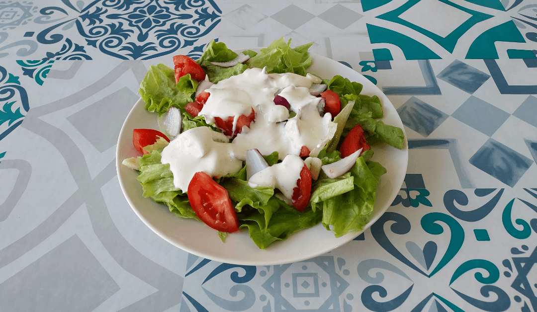 Yoghurt Salad Dressing on mixed salad.