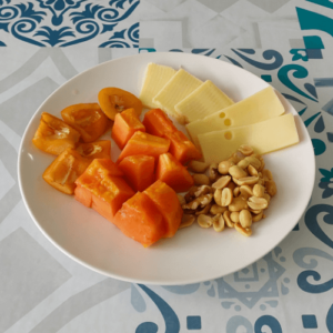 cheese plate with fruit and nuts