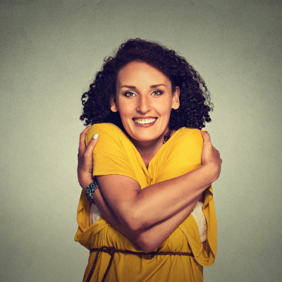 Woman hugging herself